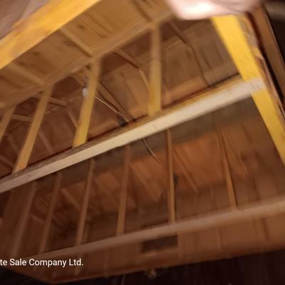 Wooden hand-crafted barn with lights inside Horse stables