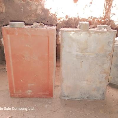 Two metal cans and an antique tin suitcase