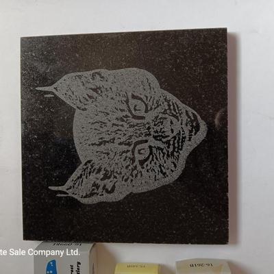 Laser art tile of a bobcat and three new pocketknives
