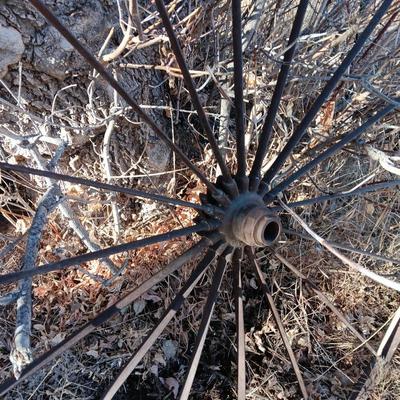 Antique 54" metal wheel in good condition - yard art