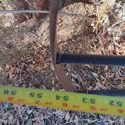 Antique 54" metal wheel in good condition - yard art