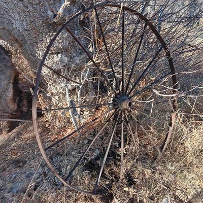 Antique 54" metal wheel in good condition - yard art