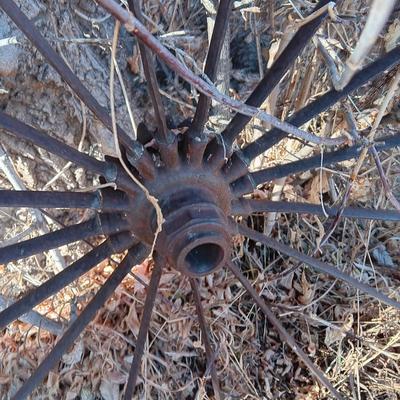 Antique 54" metal wheel in good condition - yard art