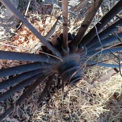 Antique 54" metal wheel in good condition - yard art