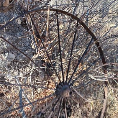 Antique 54" metal wheel in good condition - yard art