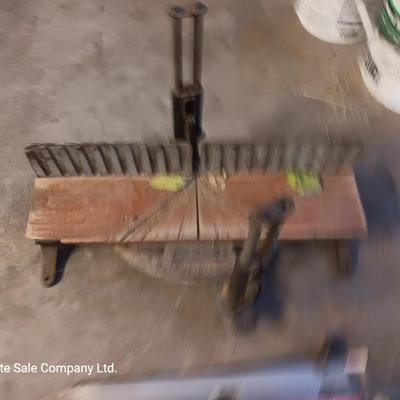 Antique cast - like Miter box with handsaw that has several blade attachments.