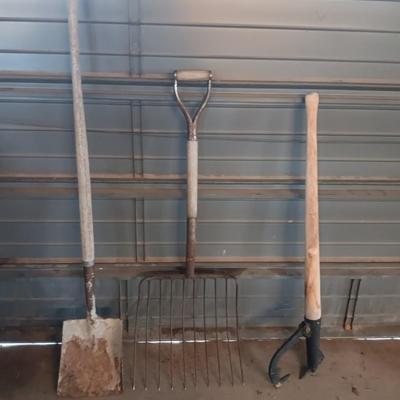 Antique pitchfork with log roller and shovel