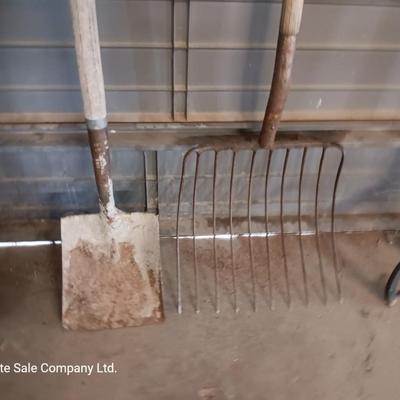 Antique pitchfork with log roller and shovel