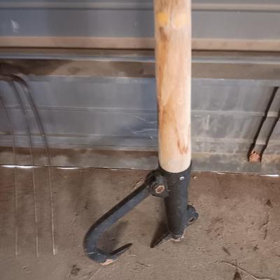 Antique pitchfork with log roller and shovel