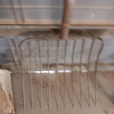 Antique pitchfork with log roller and shovel