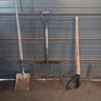 Antique pitchfork with log roller and shovel