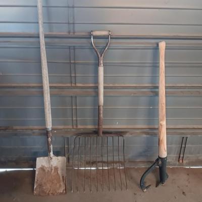 Antique pitchfork with log roller and shovel