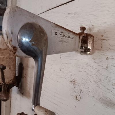 Antique can opener - hand cleaner dispenser - and pencil sharpener with a grease gun