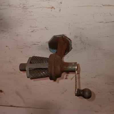 Antique can opener - hand cleaner dispenser - and pencil sharpener with a grease gun