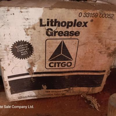Vintage tin cans partially full of chemicals with metal bucket