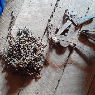 Vintage nonfunctioning animal steel traps and chains