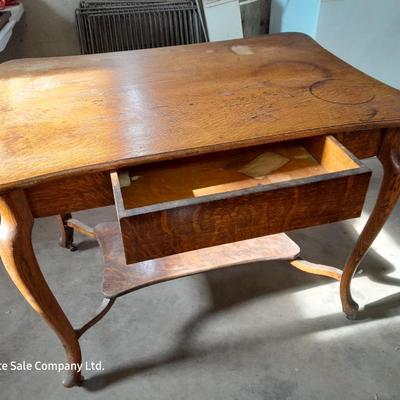 Antique two-tiered table with a drawer