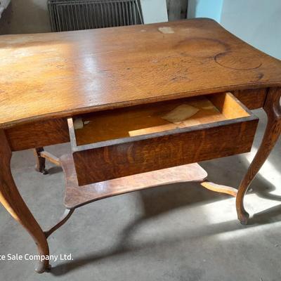 Antique two-tiered table with a drawer