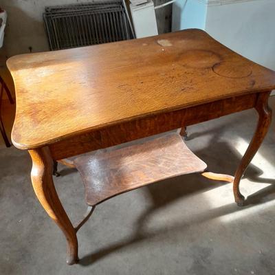 Antique two-tiered table with a drawer