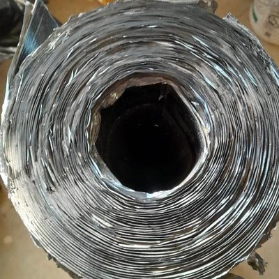 Roll of roofing material with 2 additional rolls of roof repair