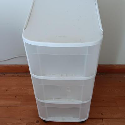 Plastic three drawer storage caddy on wheels
