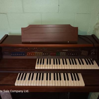 Beautiful electric Lowrey Organ with bench and music books