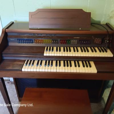 Beautiful electric Lowrey Organ with bench and music books