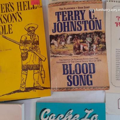 Collection of books - Cache La Poudre - Wyoming - Jackson hole - and others
