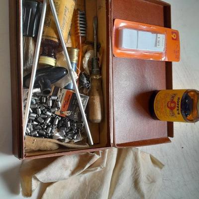 Vintage gun cleaning kit with tools and accessories