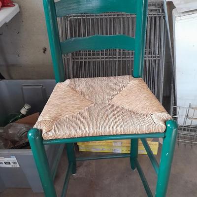 Green Ratton woven seat barstool.