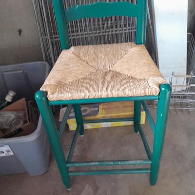 Green Ratton woven seat barstool.