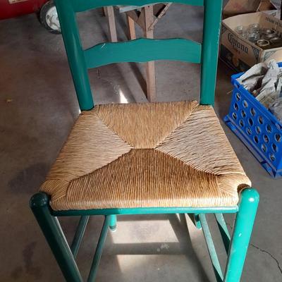 Green Ratton woven seat barstool.