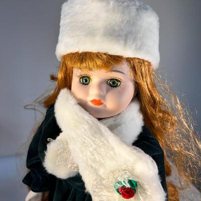 WINTER GIRL IN VELVET AND FUR PORCELAIN DOLL WITH STAND