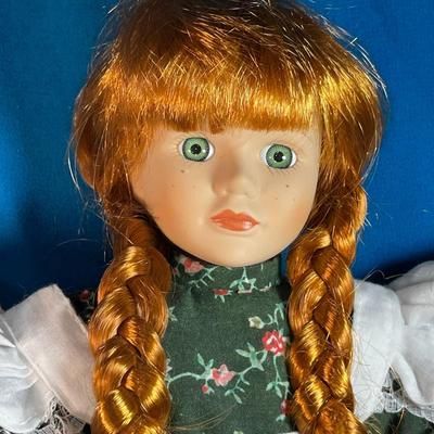 PINAFORE GIRL PORCELAIN DOLL WITH LONG RED BRAIDS