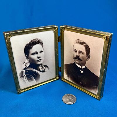 DOUBLE BRASS PICTURE FRAME WITH SEPIA TONE PHOTOS OF GREAT GREAT GRANDPARENTS