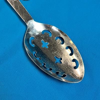 UTICA BLUE RIBBON STAINLESS WOOD HANDLED FANCY SLOTTED SPOON