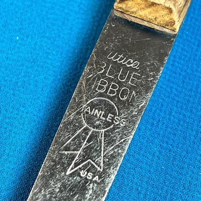 UTICA BLUE RIBBON STAINLESS WOOD HANDLED FANCY SLOTTED SPOON