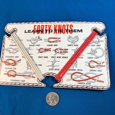 "FORTY KNOTS- LEARN TO TIE THEM" CARD WITH RED AND WHITE PRACTICE ROPE