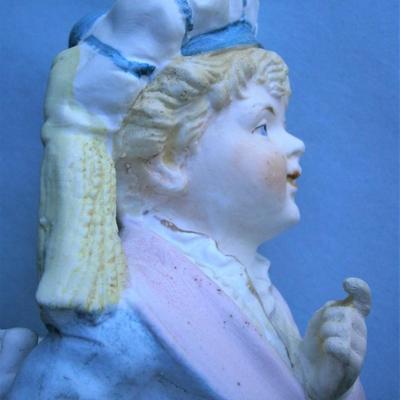 Figurine of Victorian Boy with Purse Match Holder