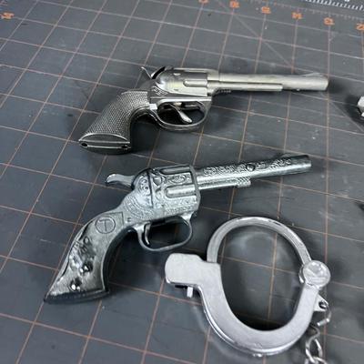 Toy Pistol and Handcuffs