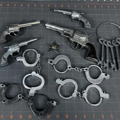 Toy Pistol and Handcuffs