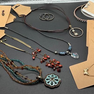 Variety of necklaces with earrings