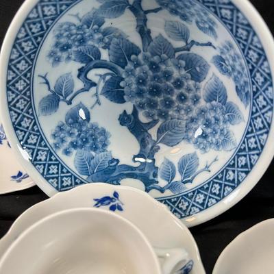 11 small fine teacups and 12 saucers Blue White