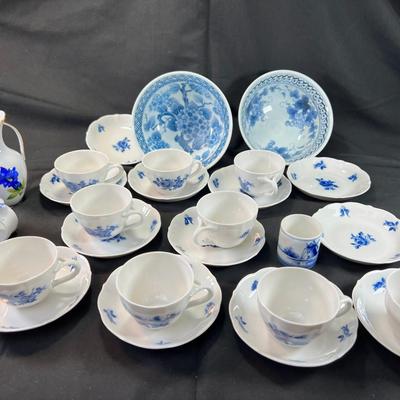 11 small fine teacups and 12 saucers Blue White