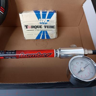 Helmet, Fanny Pack, Bicycle Seat, Bomber Shock Pump, and Torque Tube