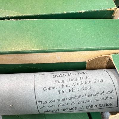 Toy player piano organ with music rolls