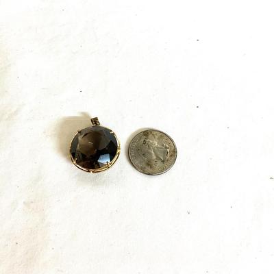1065 10k Large Round Brown Quartz Pendant