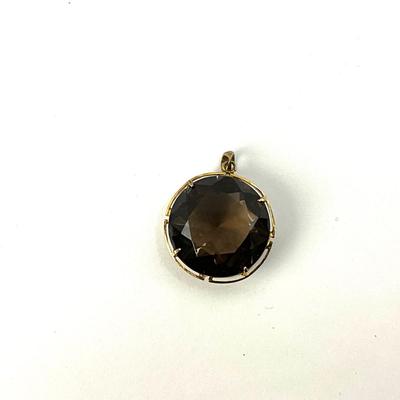1065 10k Large Round Brown Quartz Pendant