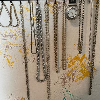 Gold and silver tone jewelry with wall hanging organizer