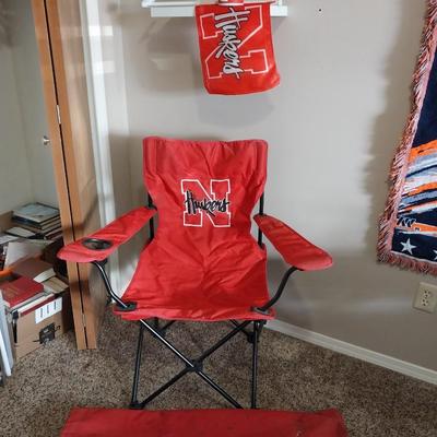 AUTOGRAPHED HUSKERS FOLDING CHAIR, WINDOW FLAG AND KOOZIE